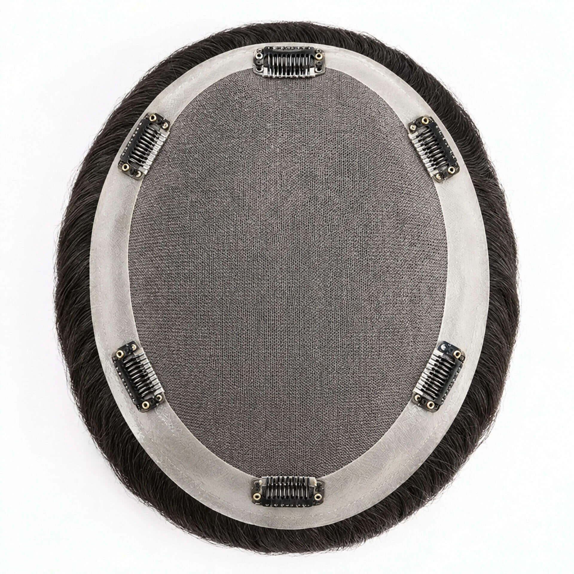 Underside of a Topee hair system showing the snap-in attachment clips